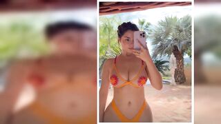 Demi Rose sizzles in see-through orange bikini as she shows off famous curves