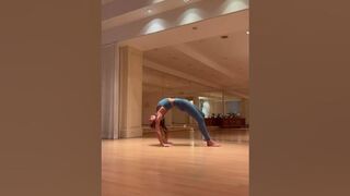 Woman doing yoga on a mat on the floor