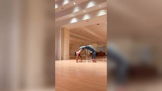 Woman doing yoga on a mat on the floor