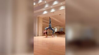 Woman doing yoga on a mat on the floor