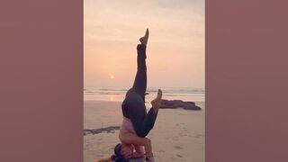 Upside down Yoga asana on the beach #yogaurmi