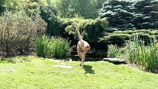 Sexy Yoga Dance Flow Woman in Bikini Lingerie by a Waterfall Pond in Nature