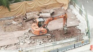 Road Construction: Excavator stretching arm to shovel #roadworks #excavator