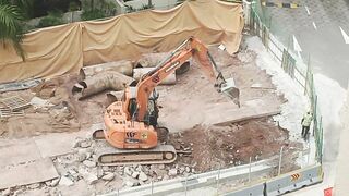 Road Construction: Excavator stretching arm to shovel #roadworks #excavator