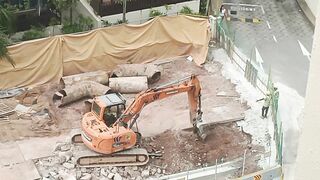 Road Construction: Excavator stretching arm to shovel #roadworks #excavator