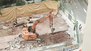 Road Construction: Excavator stretching arm to shovel #roadworks #excavator