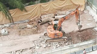 Road Construction: Excavator stretching arm to shovel #roadworks #excavator