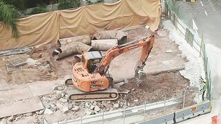 Road Construction: Excavator stretching arm to shovel #roadworks #excavator