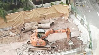 Road Construction: Excavator stretching arm to shovel #roadworks #excavator