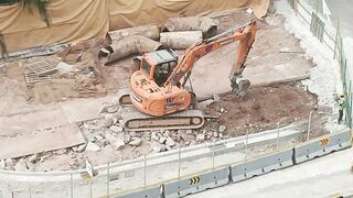 Road Construction: Excavator stretching arm to shovel #roadworks #excavator