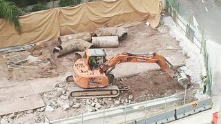 Road Construction: Excavator stretching arm to shovel #roadworks #excavator